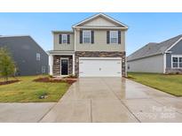 Two-story home with stone and siding exterior, two car garage at 8048 Plymouth Rd, Sherrills Ford, NC 28673