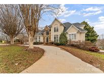 Two-story house with stone accents and a large driveway at 308 41St Avenue Nw Pl, Hickory, NC 28601