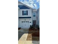 Two-story townhome with white siding, blue accents, and a two-car garage at 608 Cassidy Ct, Clover, SC 29710