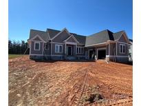 New construction featuring a stone foundation and a three car garage at 6098 Ballard Rd, Denver, NC 28037