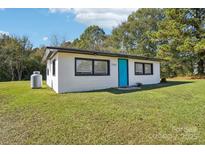 Small white house with teal door and propane tank at 2091 & 2095 Catawba River Rd, Fort Lawn, SC 29714