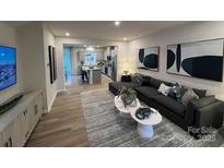 Spacious living room features an open floor plan with modern decor and plenty of natural light at 256 Laura Elizabeth Ln, Clover, SC 29710