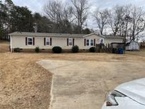 Single-wide manufactured home with a large yard and shed at 372 Forest Hollow Dr, Statesville, NC 28677