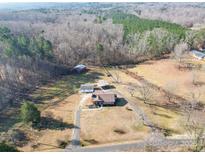 Aerial view of a ranch home, detached garage, and large lot with mature trees at 4539 Sapp Rd, Kannapolis, NC 28083