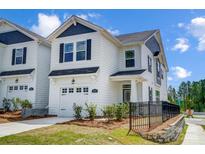 Beautiful two-story home showcasing white siding, black shutters, and a manicured lawn at 604 Cassidy Ct, Clover, SC 29710