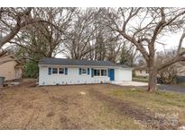 Charming ranch home with freshly painted exterior and landscaped yard at 809 Miller St, Gastonia, NC 28052