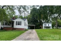 Two white homes on a large lot with a shared driveway and mature trees at 1618 4Th St, Salisbury, NC 28144