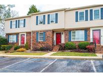 Brick front townhouse with red door and landscaping at 2705 N Center St # 65, Hickory, NC 28601