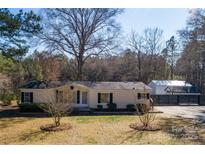 Inviting single-story home featuring a well-maintained yard and a charming exterior with lots of natural light at 4428 Turkey Ln, Rock Hill, SC 29730