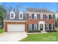 Brick house with a two-car garage and landscaped lawn at 637 Tysons Forest Dr, Rock Hill, SC 29732
