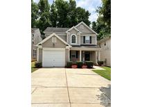 Charming two-story home featuring a one-car garage and well-maintained landscaping at 2604 Cochrane Dr, Charlotte, NC 28269