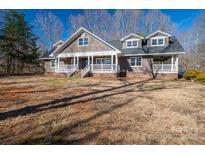 Charming home featuring a welcoming front porch and beautiful architectural details at 3044 Old Church Rd, Gastonia, NC 28052