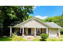 Charming house with a covered porch and brick accents at 35 Marsh Ave, Wadesboro, NC 28170