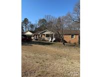 Ranch style home with carport and large yard at 784 Crestmont Se Dr, Concord, NC 28025