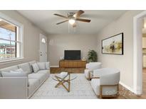 Inviting living room with a large window, ceiling fan, and comfortable seating area at 901 Wyke Rd, Shelby, NC 28150