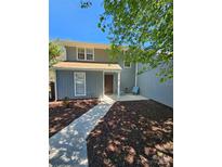 Charming two-story home with a well-maintained front yard and cozy porch seating at 11433 Kingfisher Dr, Charlotte, NC 28226