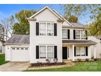 Two-story house with white siding, black shutters, and a two-car garage at 1655 Baylor Dr, Rock Hill, SC 29732