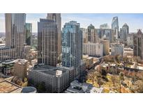 Stunning aerial view of a high-rise building with modern architecture in a thriving downtown cityscape at 210 N Church St # 2411, Charlotte, NC 28202