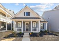 Gray craftsman style home with white accents and a front porch at 3089 Virginia Trail Ct, Fort Mill, SC 29715