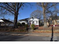 Gray house with red brick steps, situated on a tree-lined street at 315 S Hill St, Gastonia, NC 28052