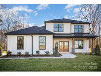 Charming new construction two-story home features a modern farmhouse exterior with a landscaped front yard at 4605 Western Union School Rd, Waxhaw, NC 28173