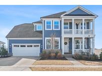 Two-story home with gray siding, white trim, and a two-car garage at 523 Rock Skip Way, Fort Mill, SC 29708