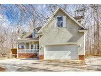 Charming home featuring a two-car garage, vinyl siding, and a cozy front porch at 2288 S Paraham Rd, York, SC 29745