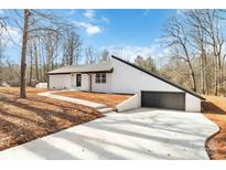 Newly renovated ranch home featuring a modern exterior and attached garage at 108 Vance Allen Ave, Rockwell, NC 28138