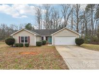 Charming single-story home with a well-maintained lawn, inviting curb appeal, and a two-car garage at 2364 Nuthatch Dr, Rock Hill, SC 29732