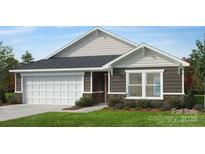 Charming one-story home with stone accents, gray siding, well-maintained landscaping, and an attached two-car garage at 326 Knotty Wood Dr # 66, Monroe, NC 28110