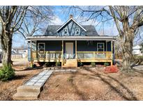 Charming renovated home with a welcoming front porch and landscaped yard at 806 S Martin Luther King Ave, Salisbury, NC 28144