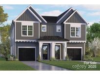 Striking two-story home with symmetrical facade, modern gray siding and black garage doors at 2238 Revolution Park Dr, Charlotte, NC 28208