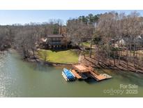 Stunning waterfront home featuring a private dock and lush landscaping at 2700 River Ridge Pl, Fort Mill, SC 29708