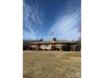 Ranch-style brick home on spacious lot with mature trees at 5452 Nc Hwy 150 Hwy, Maiden, NC 28650