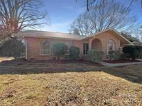 Brick ranch house with landscaped yard at 5710 Faulconbridge Rd, Charlotte, NC 28227