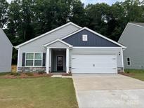 Charming one-story house with gray siding, white accents, and a two-car garage at 3238 Maple Ridge Dr, Gastonia, NC 28052
