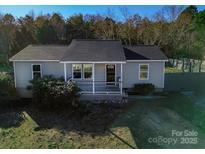 Gray exterior house with a small front porch and a landscaped yard at 108 Cloverbrook Dr, Clover, SC 29710