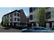Contemporary townhome with clean lines, complemented by a well-maintained lawn and community atmosphere at 115 Verbena Ne St # 12, Charlotte, NC 28217