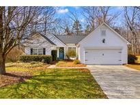 Charming single Gathering home with attached garage and well-maintained landscaping at 145 Jacobs Woods Cir, Troutman, NC 28166