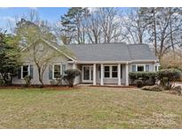 Charming single-story home with well-maintained lawn and attractive landscaping at 20331 Willow Pond Rd, Cornelius, NC 28031