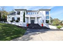 Stunning modern home with a grand entrance and landscaped grounds at 4129 Carnoustie Ln, Charlotte, NC 28210