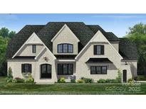 Two-story house with gray stone and black shutters at 01 Mcfalls Dr, Indian Land, SC 29707