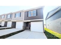 Modern 2-story townhome with attached garage and stone accents at 1010 10Th Ne Ave, Hickory, NC 28601