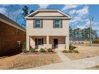 Brick two-story house with a front yard and walkway at 3010 Lisburn St, Mint Hill, NC 28227