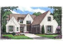 An elegant house with a brick exterior and neutral accent shutters featuring double garage, and well-manicured lawn at 722 Hillside Ave, Charlotte, NC 28209