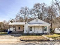 Charming white house with a metal roof and porch at 1790 17Th Ne Ave, Hickory, NC 28601