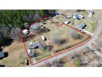 Expansive property showcasing the house, outbuildings, and land outlined in red at 1354 Mirror Lake Rd, Lincolnton, NC 28092