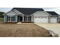 Charming single-story home with stone accents, a two-car garage, and professionally landscaped yard at 160 Swann Rd # 6, Statesville, NC 28625