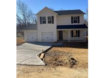 Two-story house with a two-car garage and a concrete driveway at 1606 Lincoln Dr, Shelby, NC 28152