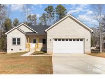 Charming single-Gathering home with a white brick exterior, attached two-car garage, and a well-maintained front yard at 2365 Kool Park Ne Rd, Hickory, NC 28601